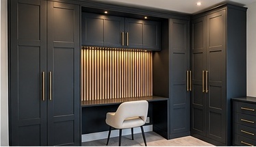 Bespoke fitted home office with dark cabinetry, slatted timber back panel, integrated desk and lighting by C H Joinery Solutions